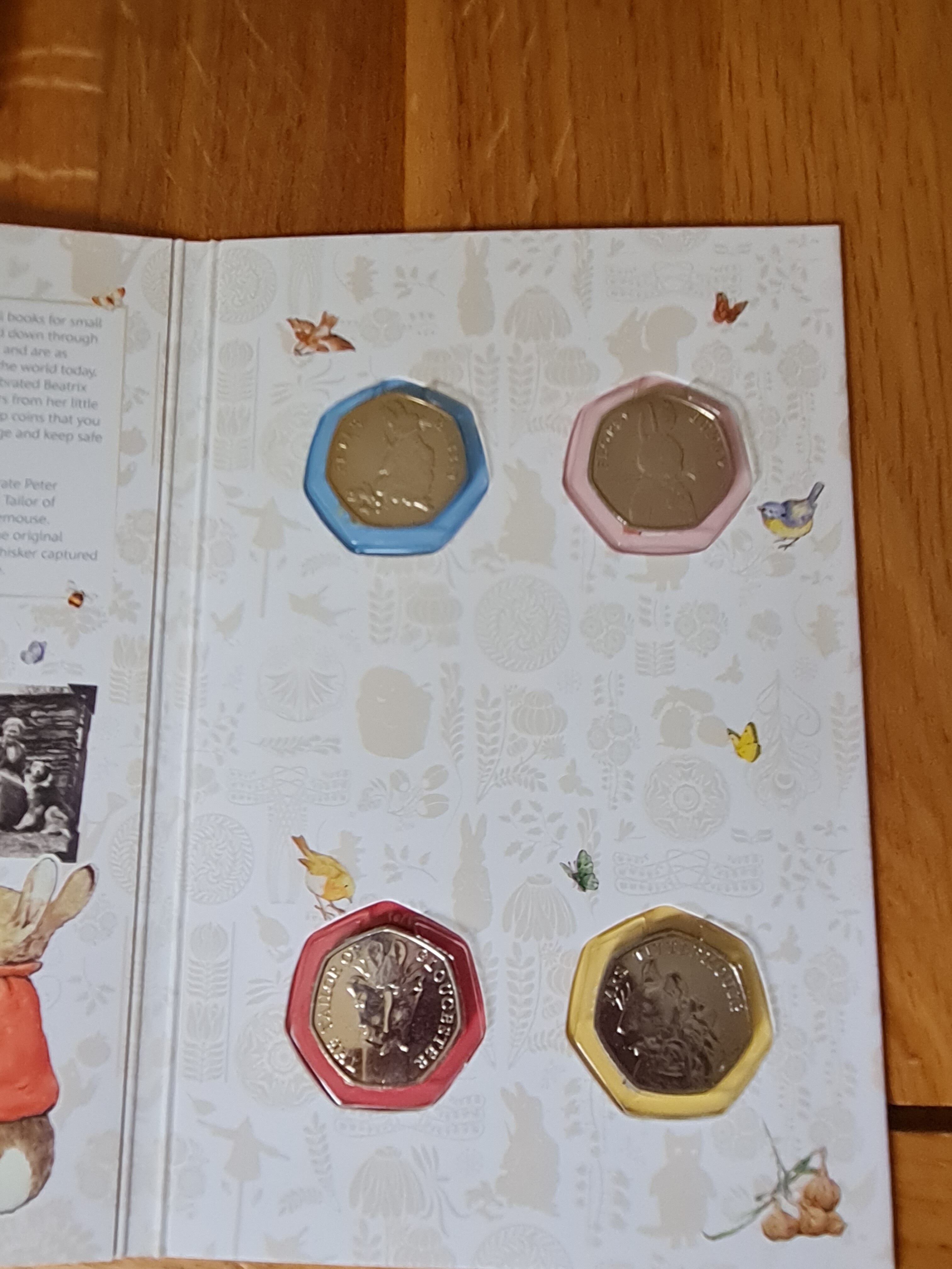 Olympic & Peter Rabbit 50p Coin full set's in folders. - All non PM ...