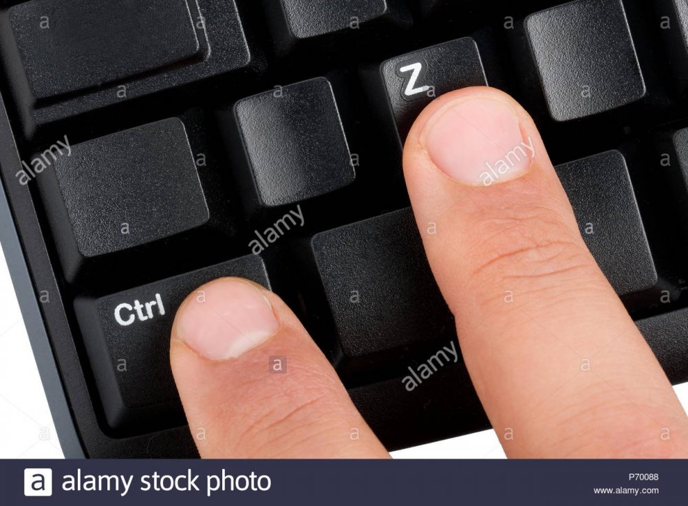 closeup-shot-of-two-male-fingers-pressing-control-z-shortcut-on-a-black-desktop-wireless-computer-keyboard-P70088.jpg