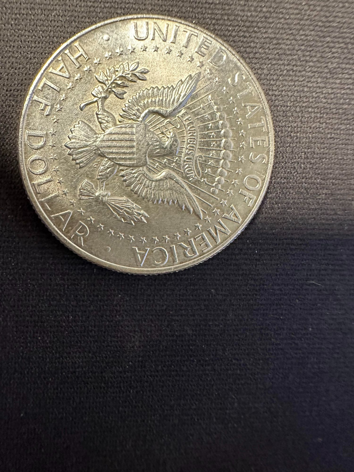 Does this silver kennedy 1964 coin edge reeding look normal