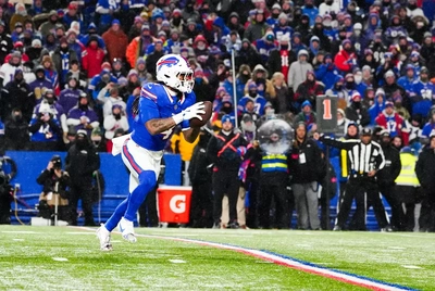James Cook heads upfield after making one of his three receptions Sunday night.