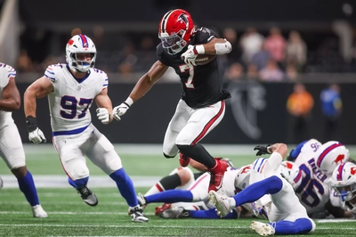Bijan Robinson Skips Over A Pile of Hapless Bills Defenders And Scampers Downfield