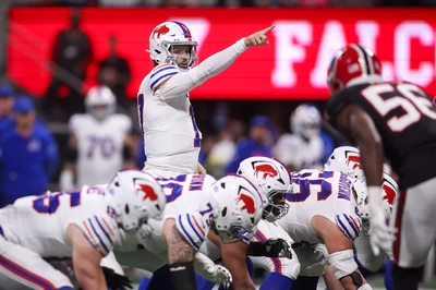 Josh Allen points to an open area of the field so his receivers know where they should avoid going.