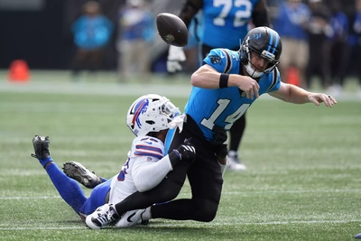 Greg Rousseau tackles Andy Dalton and forces him to cough up the ball in the first half of a game that saw a dominant performance from the Bills DL.