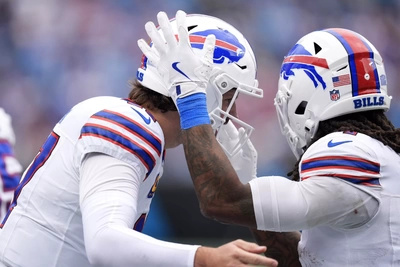 James Cook celebrates his 2nd half TD with teammate Josh Allen. Luckily the Refs didn't throw a flag for a facemask penalty on Cook.