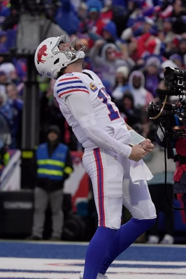 Josh Allen celebrates after scoring his 3rd rushing TD of the game, he also had 3 passing TD, tying his own record of being the only QB in the SB era to have 3 + 3.