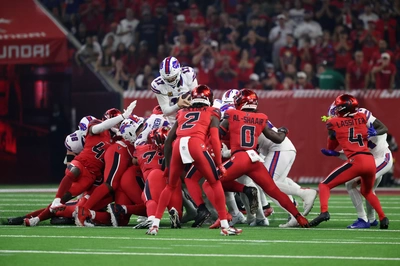 In one of the game's few bright spots, Josh Allen does his best Doughboy imitation as he goes up and over the top for a first down on a fourth and short.