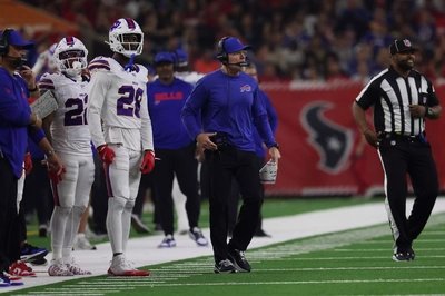 Possibly Wearing His Wife's Glasses HC McDermott Looks to be Paging His Agent