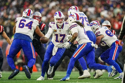 Josh Allen prepares to hand the ball off to the exceptional James Cook, who delivered another superior game, running 22 times for 107 yards and 2 TDs, while catching two passes for 4 yards and another TD.