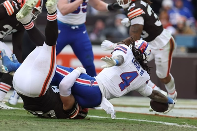 James Cook takes advantage of landing on LB Carson Schwesinger instead of the ground, to extend the ball and break the plane of the end zone on his first half TD.