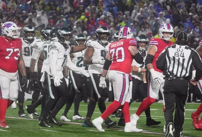 Classless Eagles yuck it up after blocking an extra point attempt by the Bills.