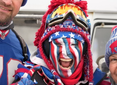 Star-spangled and Zubaz-faced Becky Rice Kane whoops it up with friends and family at the pre-game tailgater before the stadium's final home game.