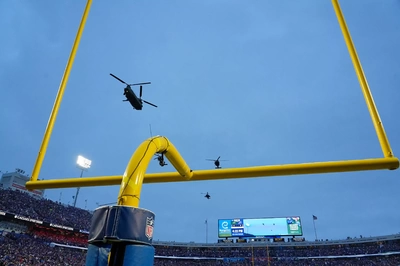 Pregame flyover by the 10th Combat Aviation Brigade to commemorate the last game of the old stadium. Rumor had it they were on alert to guard the goal posts in case fans stormed the field after the game  ; )