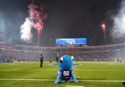 Billy Buffalo cops a squat and takes in the post game fireworks and reverie after the Bills 35-8 victory for the stadium's finale. Next year he'll be sitting on real grass.