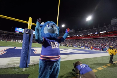 I could be wrong, but I think that's Bill Belichick who showed up to party at the last game at the stadium?
