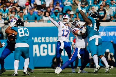 Josh Allen launches a second period pass as both O Lineman are victims of uncalled illegal hands to the face by Jags pass rushers.