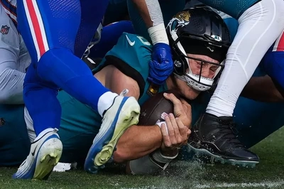 Trevor Lawrence burrows through the line for a 4th quarter first down. How that honker of a nose he has fit into the chin guard, I'll never know.