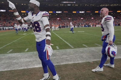 Sam Franklin Jr. and Reid Ferguson display their displeasure at the game officials who waited until halfway through the OT period to start throwing flags for questionable infractions.