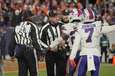 Bills CBs Tre White and Taron Johnson argue their point, but the Refs inform them that the money has already been deposited in their Swiss accounts and there's nothing they can do for them.